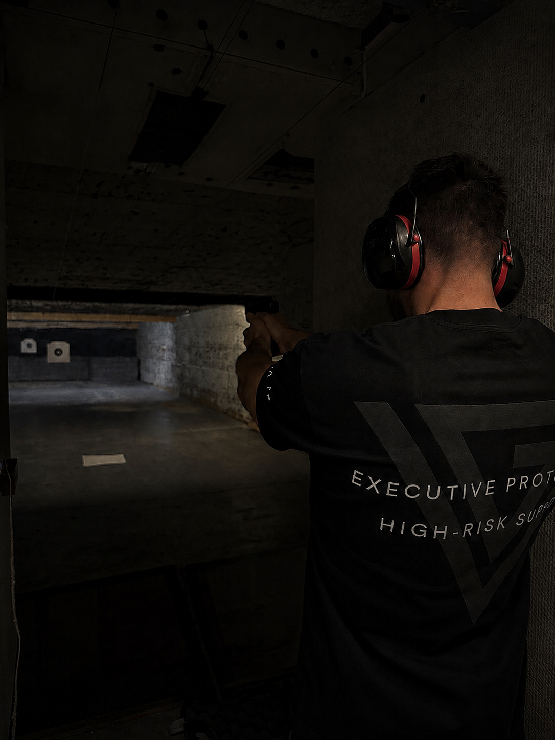 Protection officer training on an indoor range
