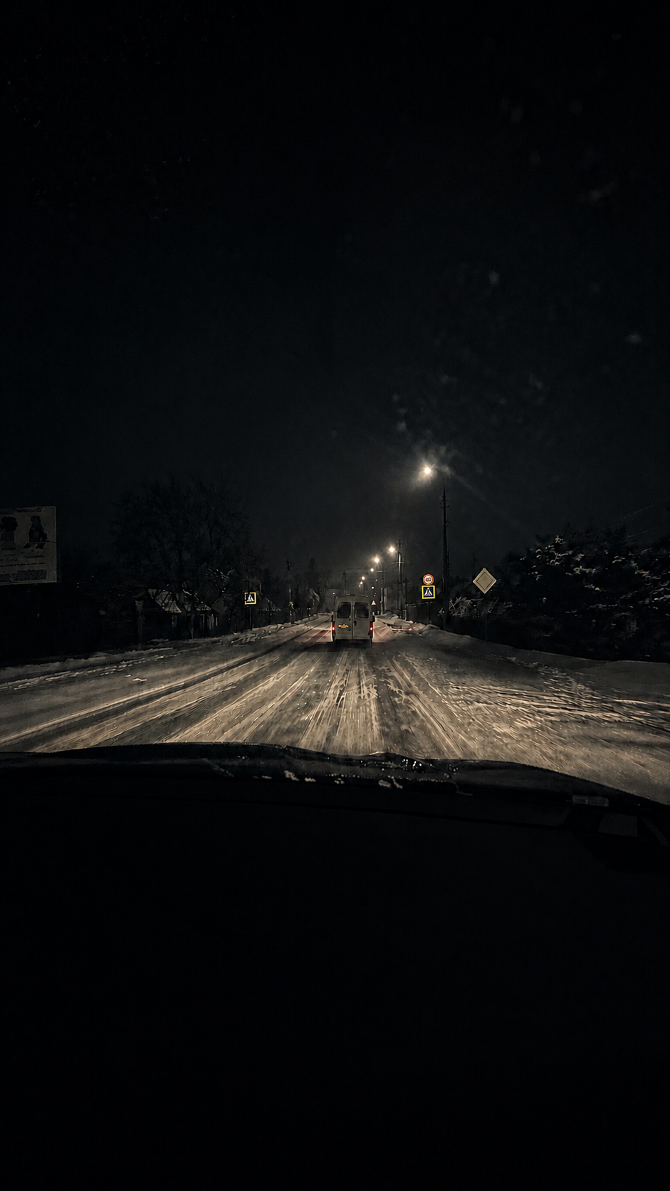 Vehicle moving through a snow-covered road at night in an operational environment